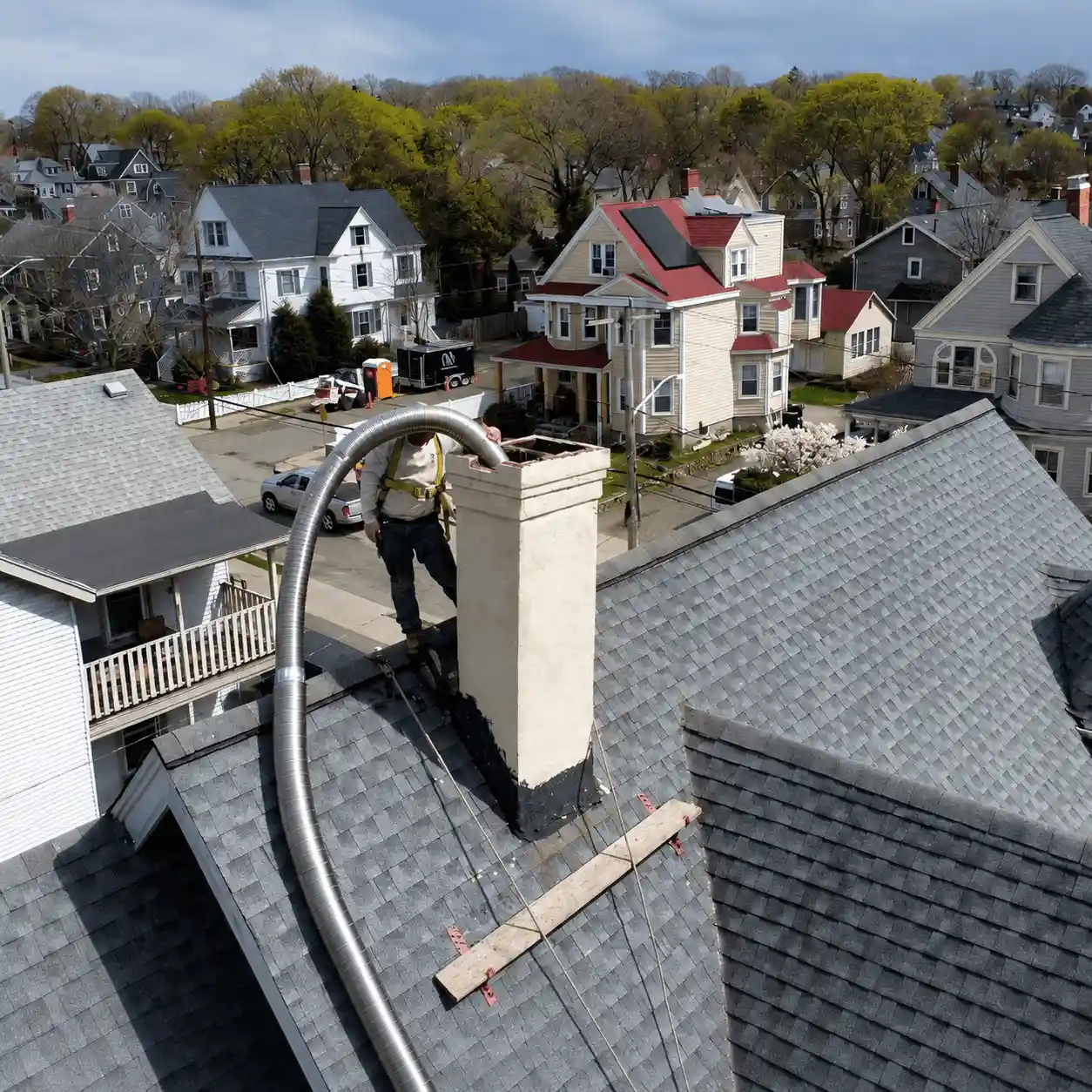 Chimney technician installing new liner system