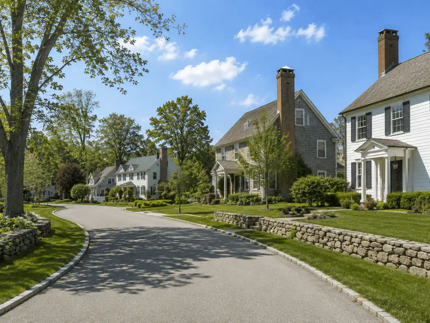 Spacious residential street with traditional chimney houses