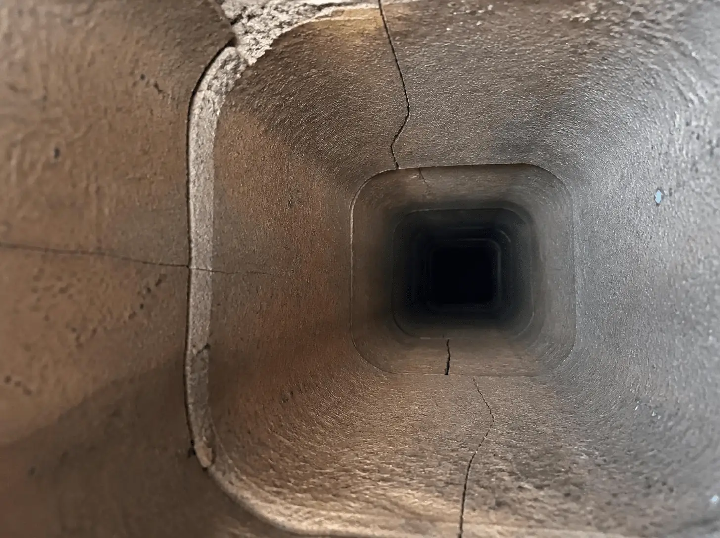 Cracked chimney liner interior inspection view