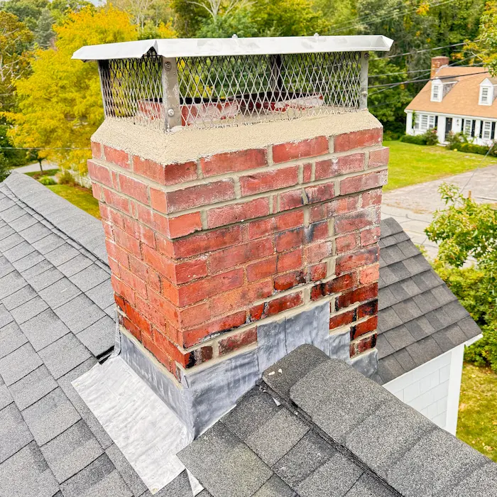 Brick chimney with new chimney cap